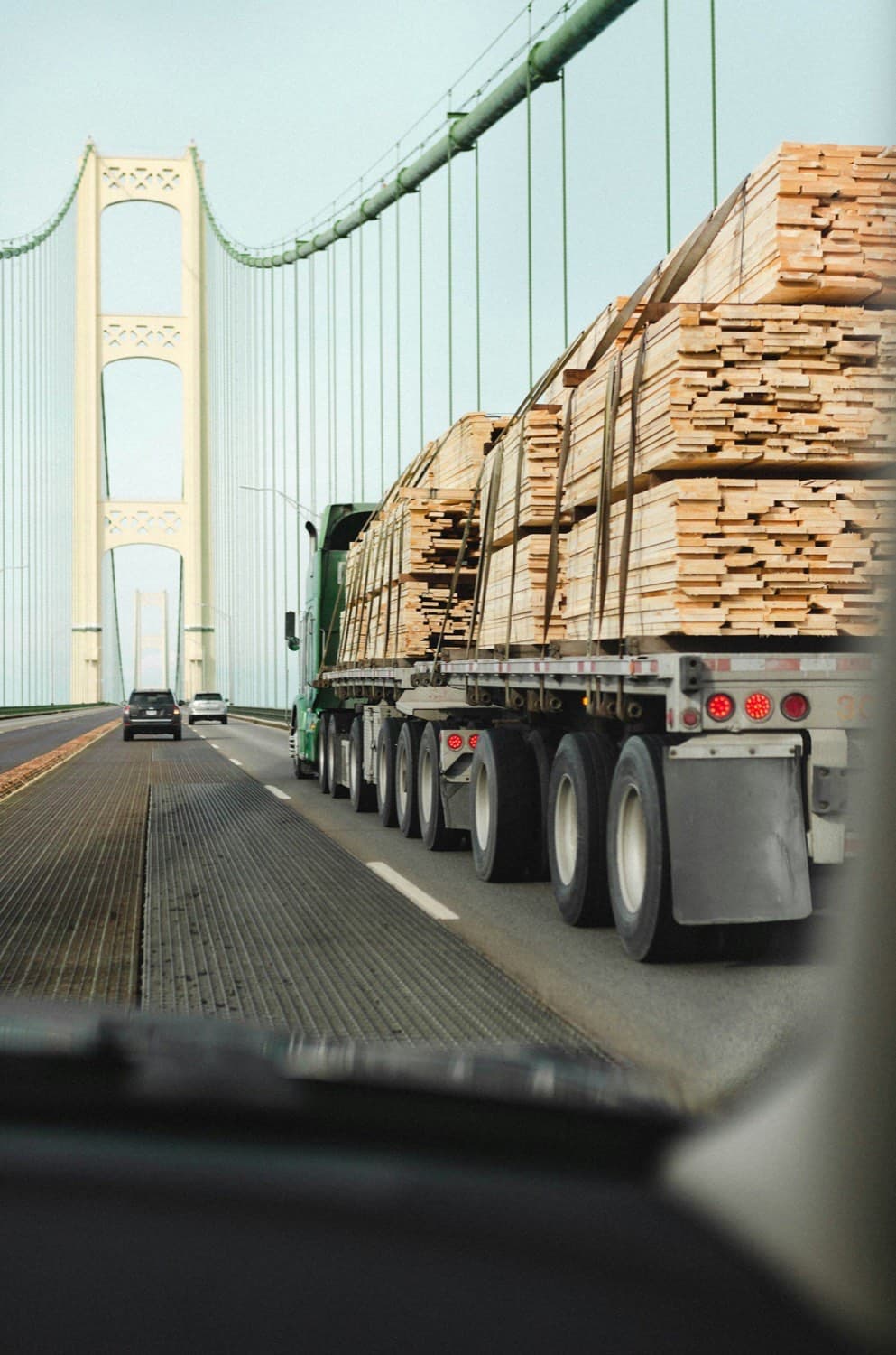 Flatbed trailer loaded with sheeted and strapped cargo