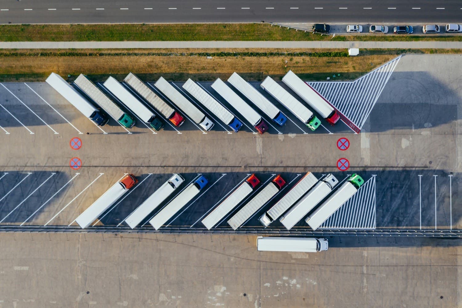 Aerial view of a truck yard with trailers parked in rows