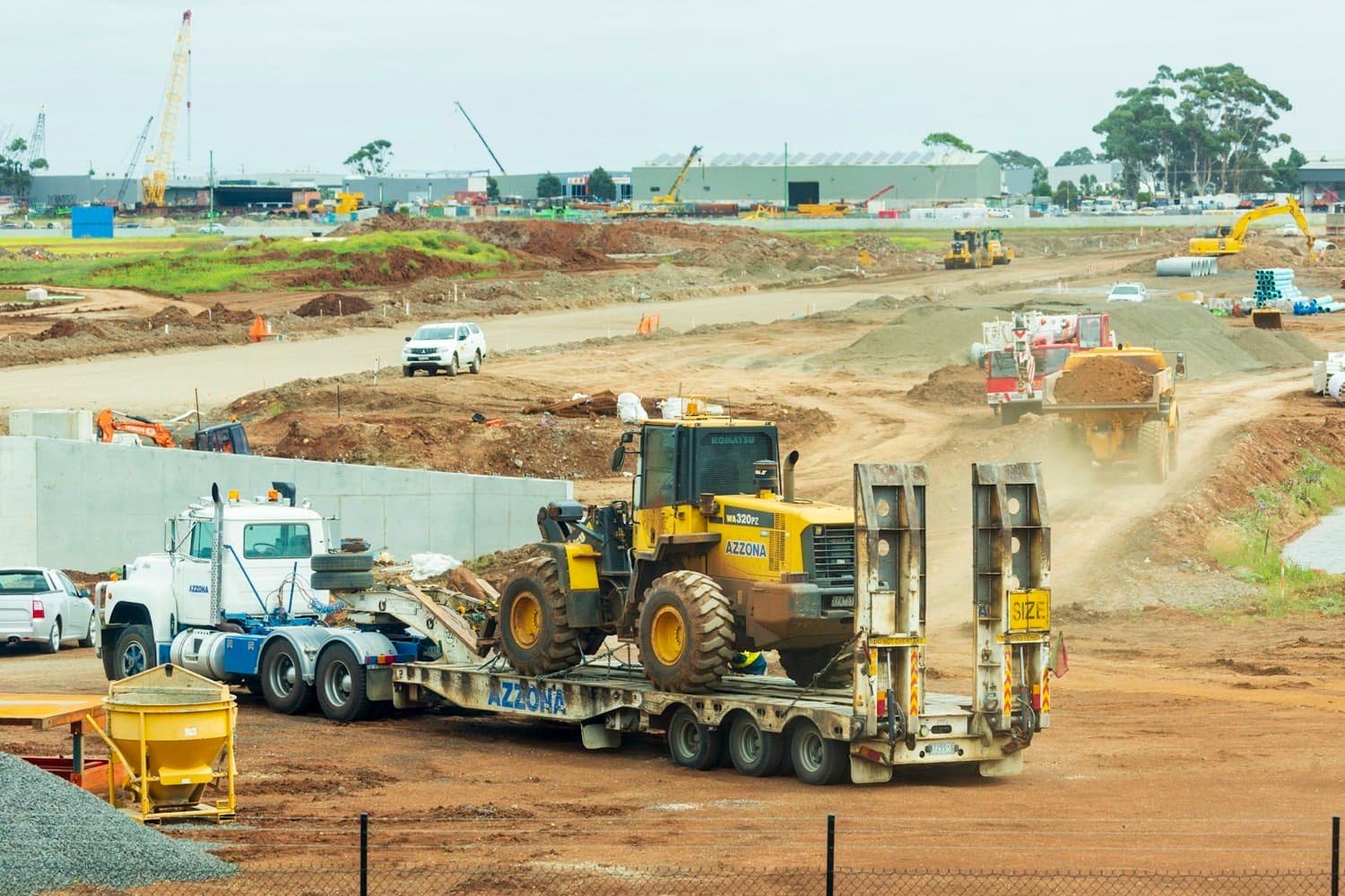 Lowbed trailer loaded with a tracked excavator